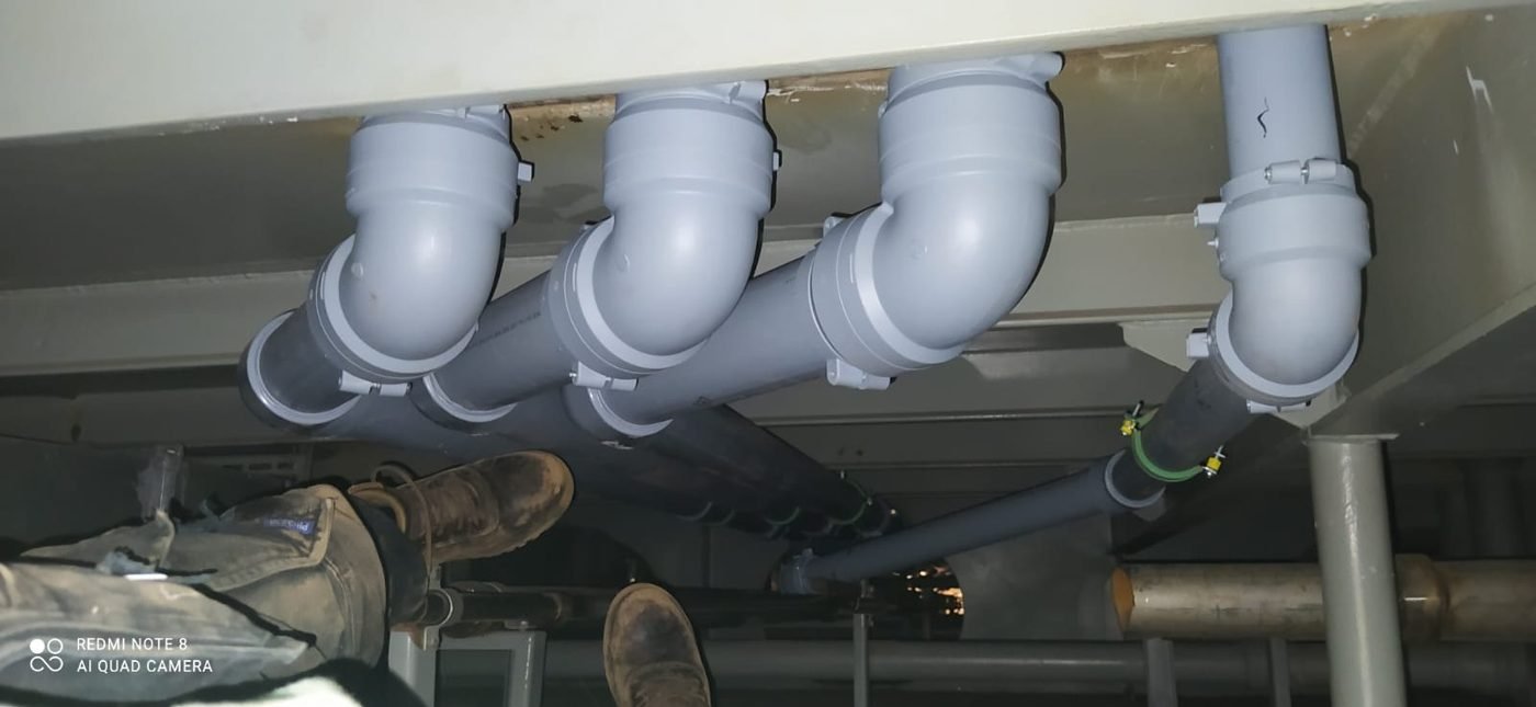 Drainage lines — Elbow assemblies under deck structure