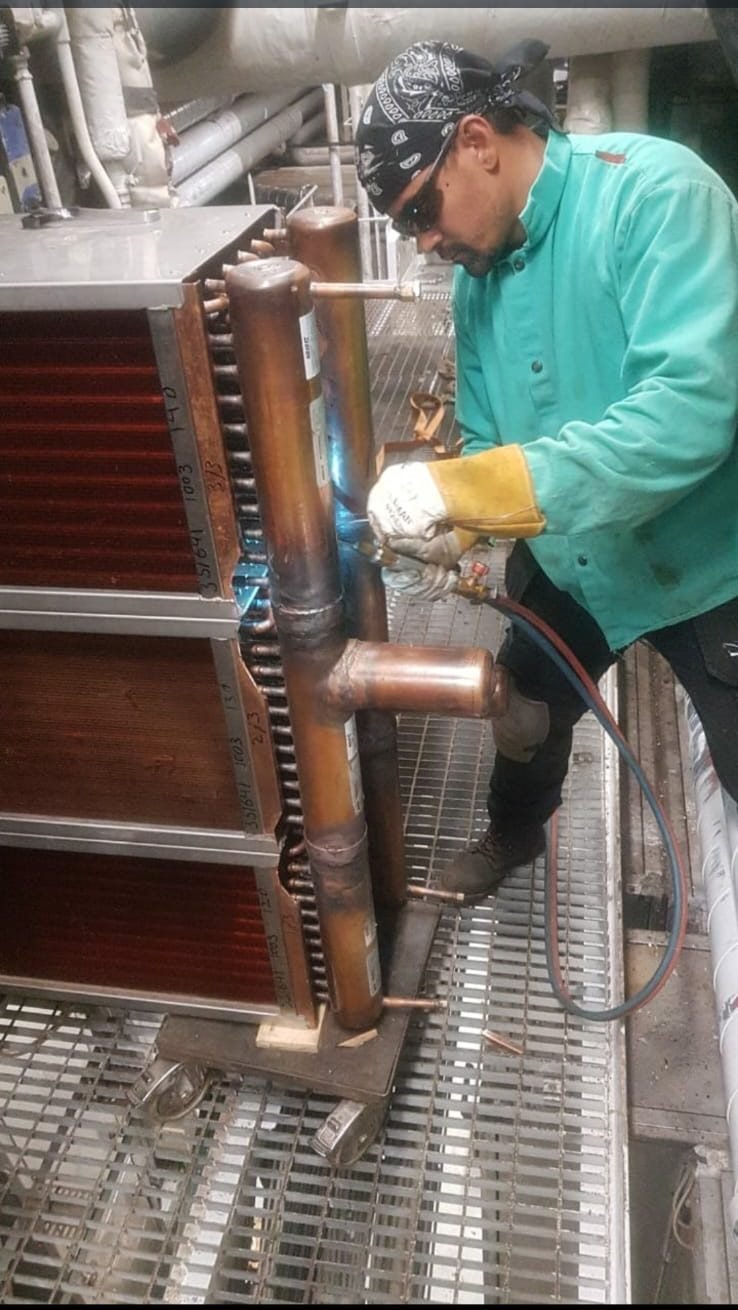 Brazing in progress — Oxy-fuel work on the exchanger headers
